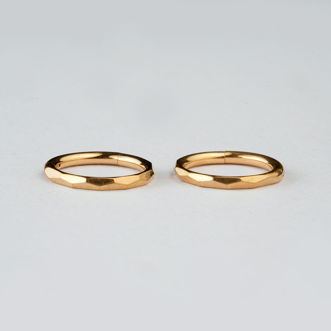 Golden faceted-edge ASTM F-136 titanium hinged segment ring