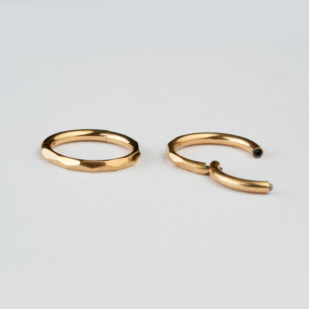 Golden faceted-edge ASTM F-136 titanium hinged segment ring