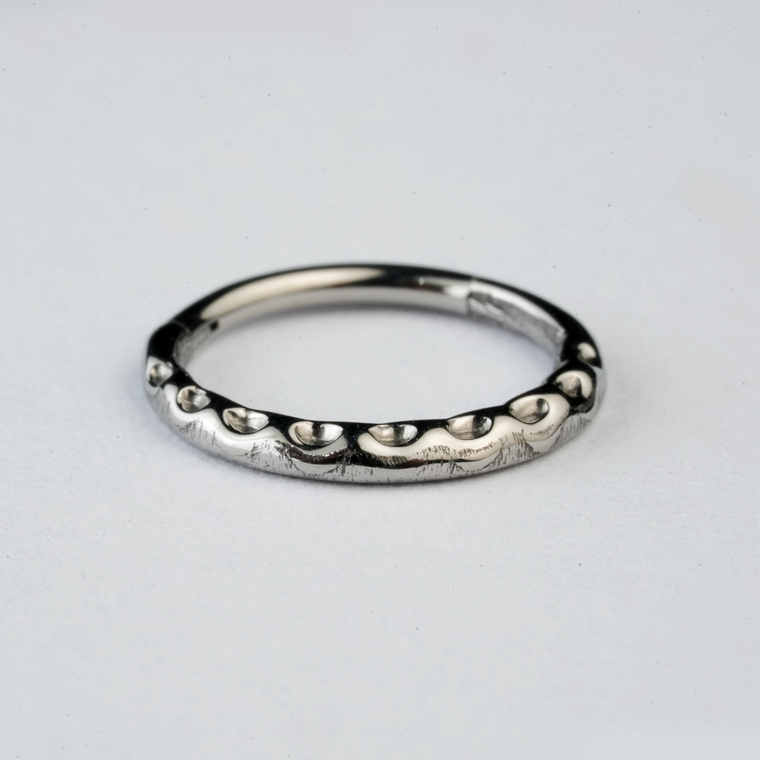Silver beaded-edge ASTM F-136 titanium hinged segment rings