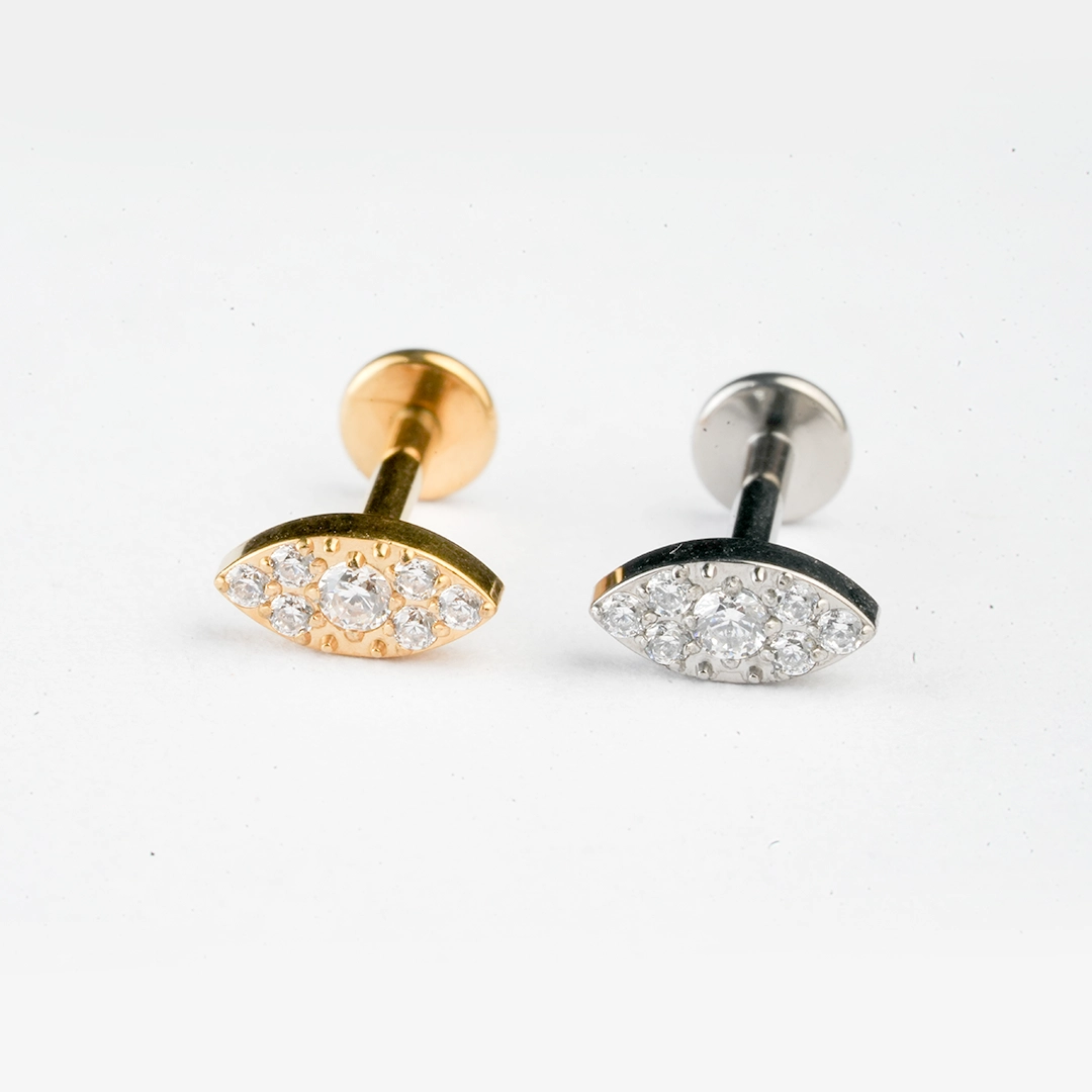 Pavé eye zircon ASTM F-136 titanium flat-back labret studs in golden and silver