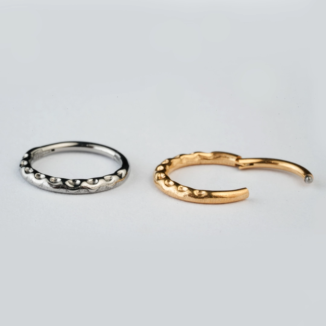 Golden and silver beaded-edge ASTM F-136 titanium hinged segment rings