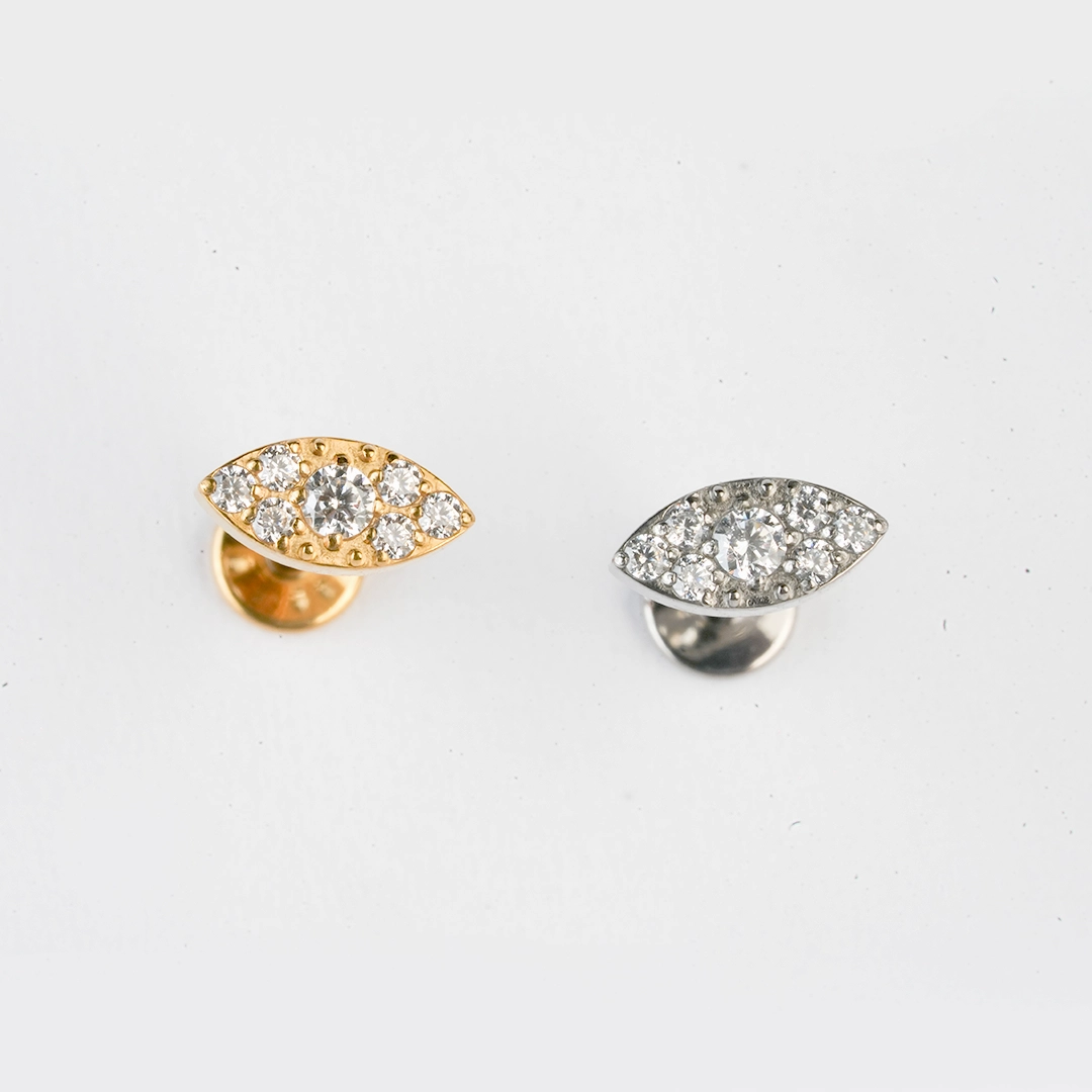 Pavé eye zircon ASTM F-136 titanium flat-back labret studs in golden and silver