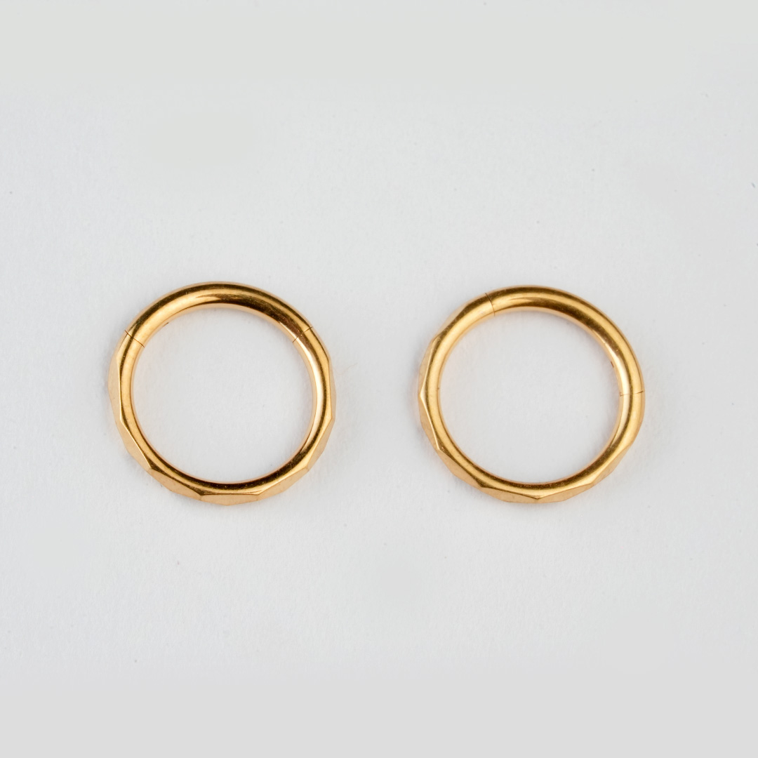 Golden faceted-edge ASTM F-136 titanium hinged segment ring