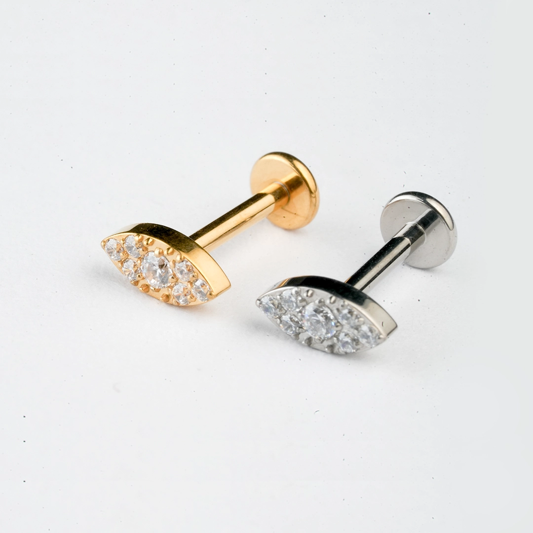 Pavé eye zircon ASTM F-136 titanium flat-back labret studs in golden and silver