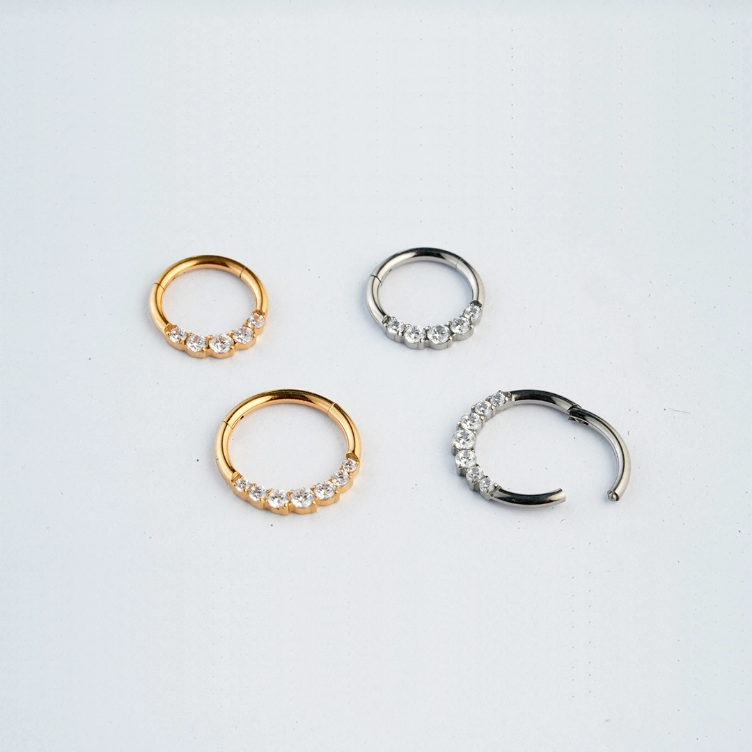Graduated round zircon ASTM F-136 titanium septum clicker in golden and silver